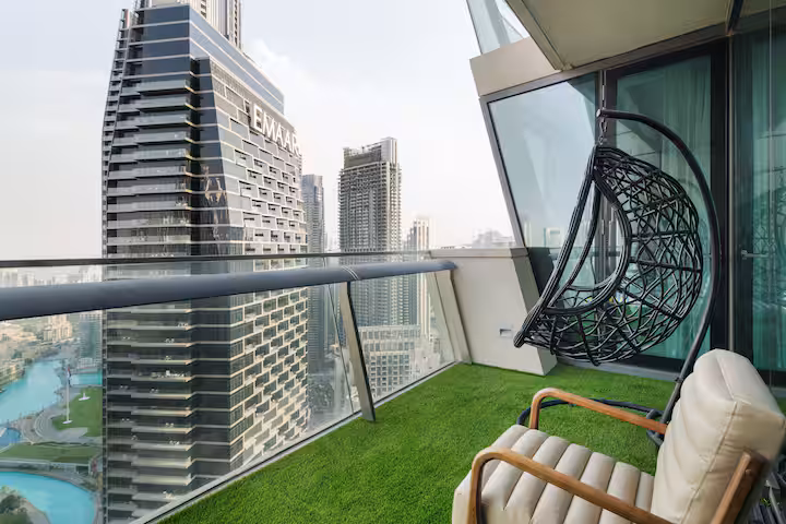 Burj Vista: The balcony by day, the Downtown towers and the lake