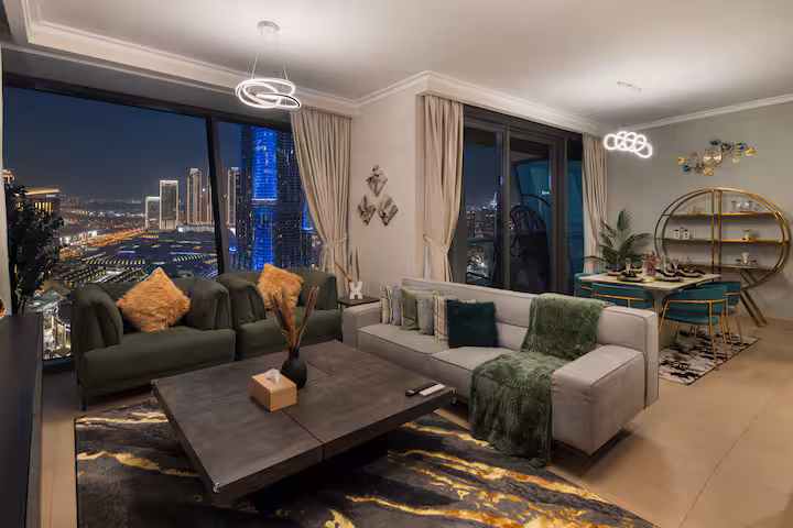 Burj Vista: The living room at night, the tower lit in the window
