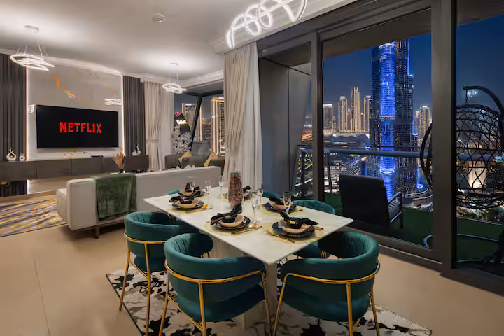Burj Vista: The dining table at night, the Burj Khalifa behind