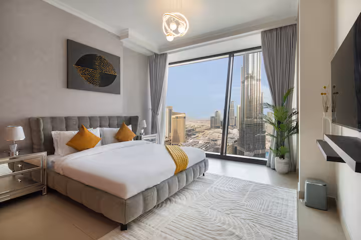 Burj Vista: Bedroom one, a king bed facing the window and the Burj