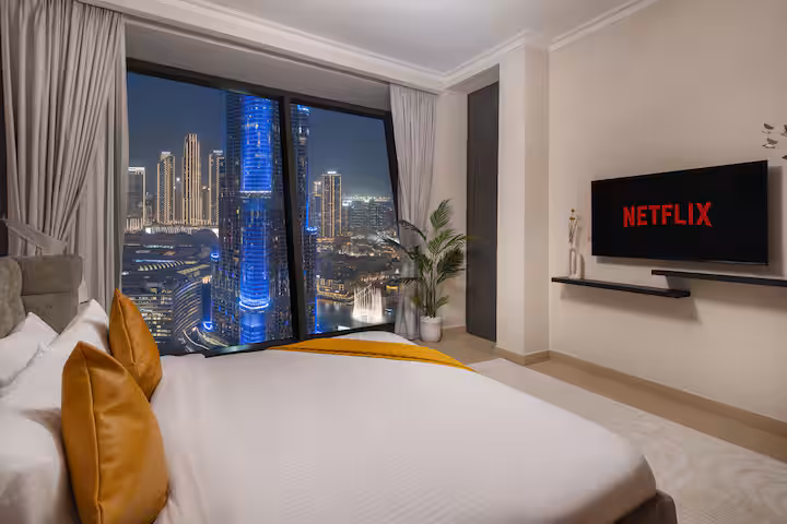 Burj Vista: Bedroom one, the television on the wall
