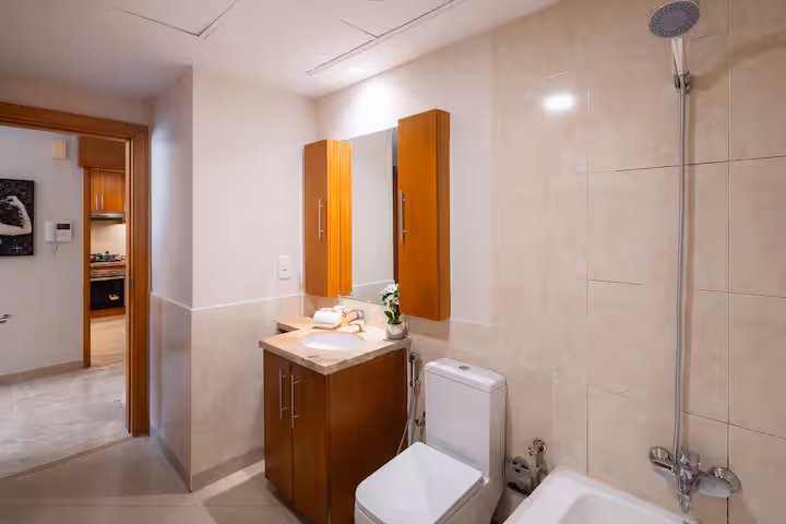The Links East: The bathroom, a bath with a shower over it