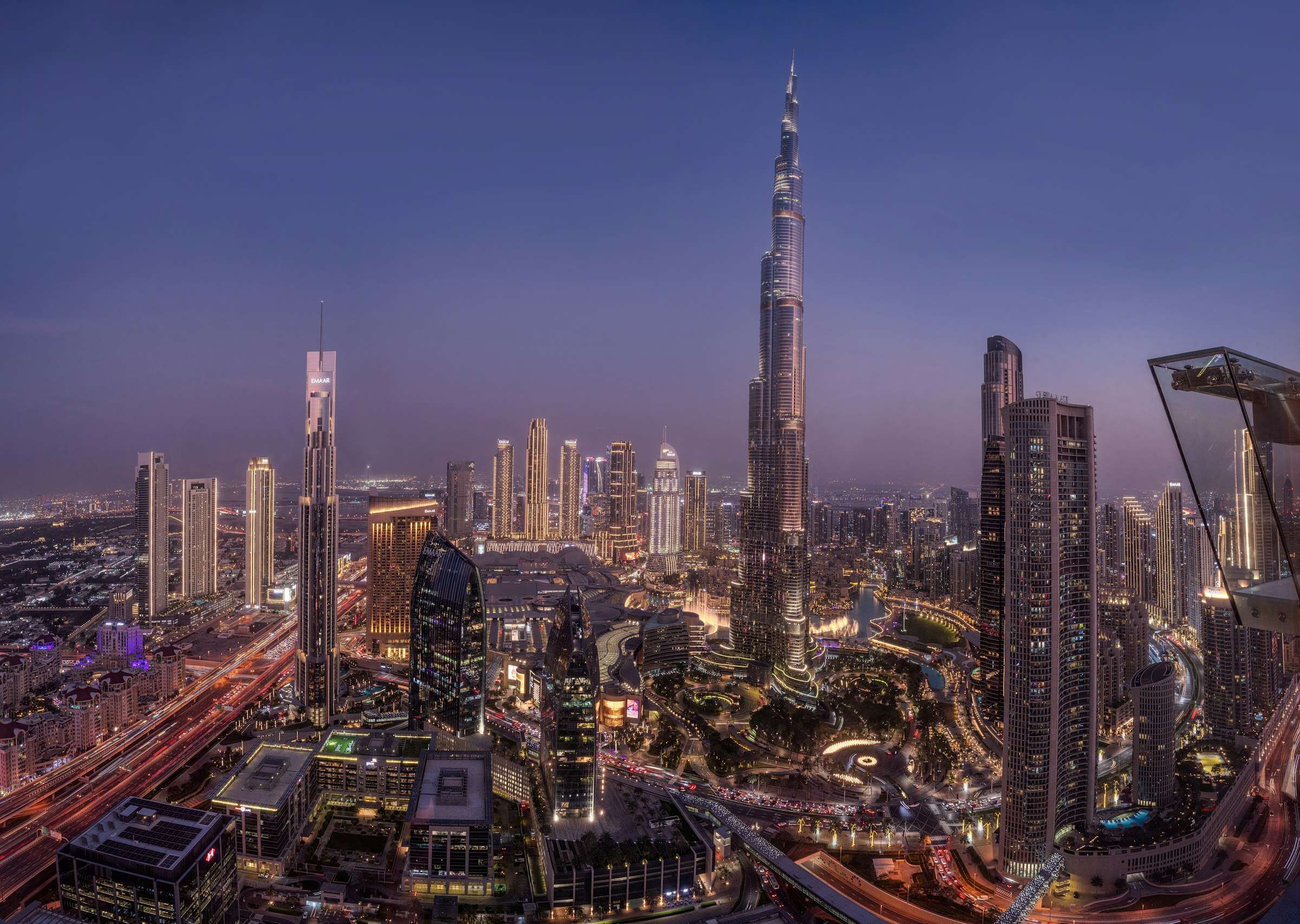Downtown Dubai at blue hour, seen from high up, with the Burj Khalifa at the right
