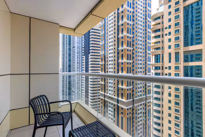 Sulafa Tower, Dubai Marina: the balcony of a two-bedroom holiday home with a table and chairs, the Marina below