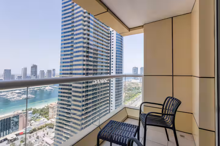 Sulafa Tower: The balcony, the sea at the end of the gap between the towers