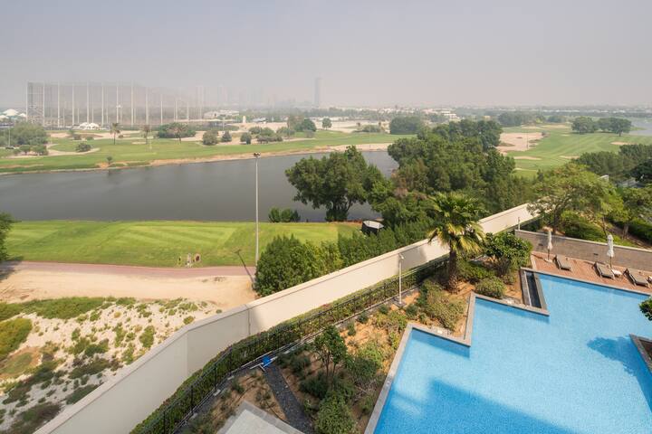 Vida Residences, The Hills: the pool deck of a family holiday home, the Emirates Golf Club fairways beyond