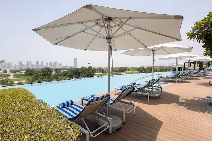 Vida Residences: The pool and the fairways in the afternoon