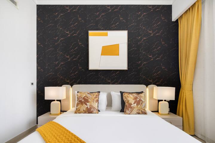 Vida Residences: Bedroom one, the dark feature wall